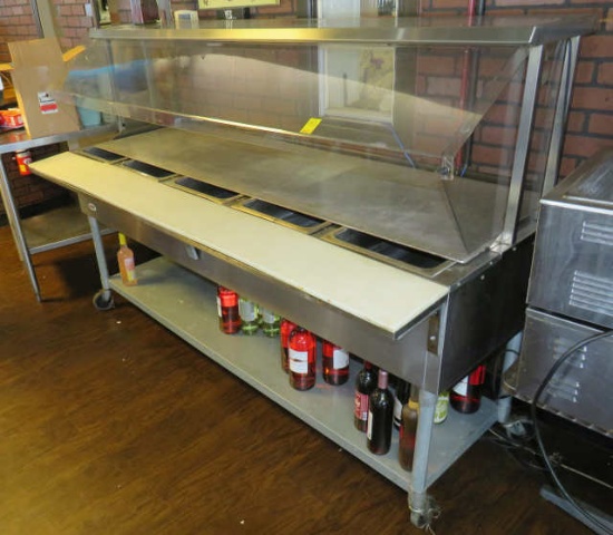 electric four bay steam table with stainless full pans, folding shelf
