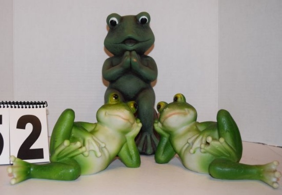 mixed group of frogs two ceramic green frogs laying down and one dark green frog sitting up with han