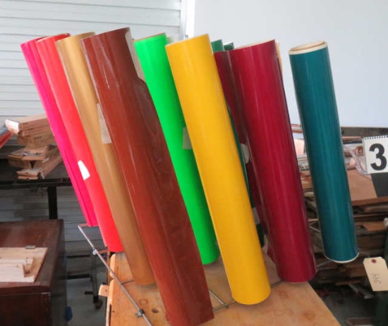 group of 16 partial rolls of sign making vinyl 24" wide