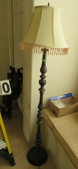 ornate floor lamp with fringed lamp shade