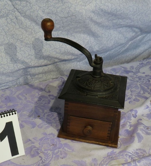 antique cast iron coffee grinder mounted on oak box