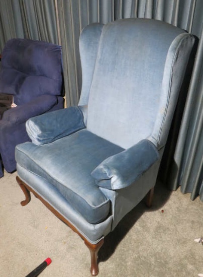 Medium blue upholstered wing back parlor chair