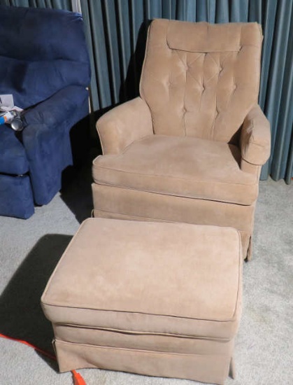Swivel upholstered beige chair with matching foot stool