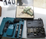 Group of tools including solder gun, cordless Makita drill motor, deepwell