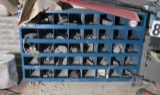 Blue parts bin with slots for rivets, bolts, screws and other fasteners