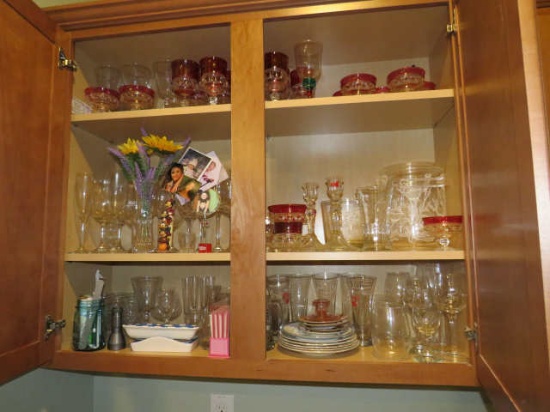mixed glassware in kitchen cabinet