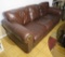brown leather 3 seat sofa appears to be in good condition 87” long