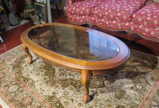 oval wood coffee table 52” long x 27” deep x 16” high with beveled glass insert