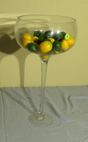 glass vase in shape of a wine glass with plastic fruits 20” high x 10” diameter