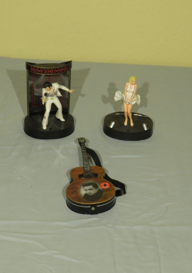 music figures = Johnny cash guitar plays tune, Elvis figure on mike plays tune, Marily Monroe figure