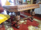 ornate carved walnut finish dining room table length 61” with (4) 10” leaves