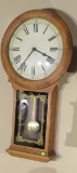 pendulum style wall mounted battery powered clock 33” x 18” wide