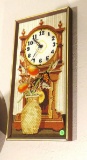 needle point, battery powered clock 21” x 11” wide