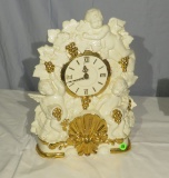 ceramic mantle clock with cherubs, gold leaf  battery operated 16” high x 11” wide