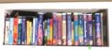 collection of mixed children's DVDs and vhs tapes