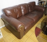 brown leather 3 seat sofa appears to be in good condition 87” long