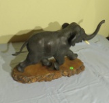 cast iron elephant on wood base (one tusk broken and missing) 12” high x 20” long x 6” deep