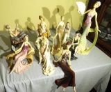 9 piece collection of acrylic figures of ladies 10” to 18” high