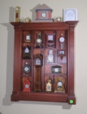 Franklin Mint miniature clock collection with Franklin Mint wall cabinet  dimensions 22” h x 17” lon
