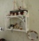 wicker shelf with boat and other small décor