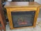 eclectic space heater with lighted fire logs