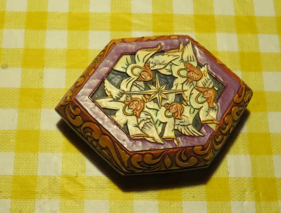 carved and hand painted pin box with angels and Joseph, Mary, Jesus on one side and flips over to th