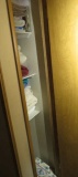 mixed linens, towels, sheets in hall closet