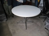 42”Diameter white Formica top table with chrome legs
