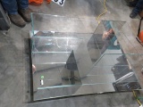 Glass cube coffee table/display table, on casters, by  Napzzui  (note one of the glass panels on sid
