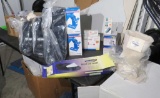 box of retail medical supplies – blood pressure wrist monitors, insulin protectors, insulin syringes