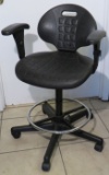 Black hydraulic stools on wheels