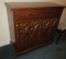 Pecan finished carved wood sideboard  38”H x 41”Lx 19”D.