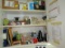 mixed items in utility cabinet, light bulbs, supplies, cords, tapes, fasteners, shopping bags