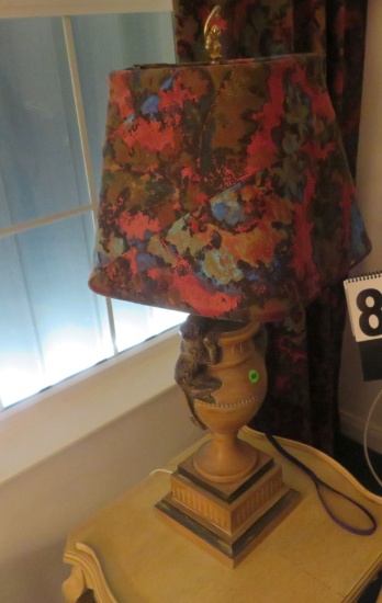 Table lamp with carved wood trophy body, coordinating shade. 29” H x 22” W.