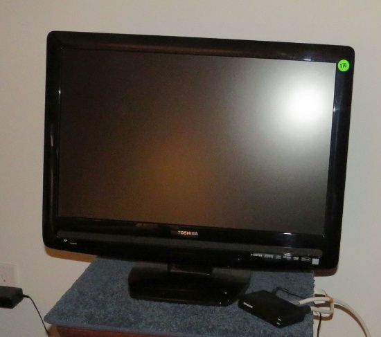 Toshiba television on stand, 17” H x 21” W.