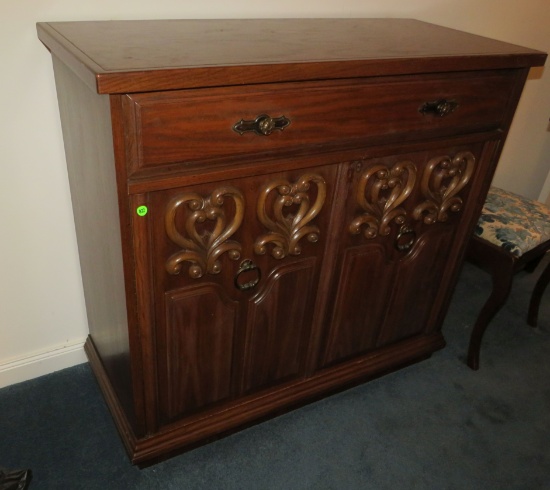 Pecan finished carved wood sideboard  38”H x 41”Lx 19”D.
