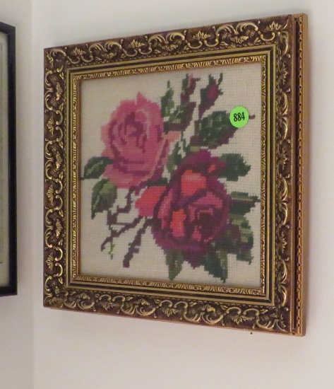 floral needlework embroidery framed under glass
