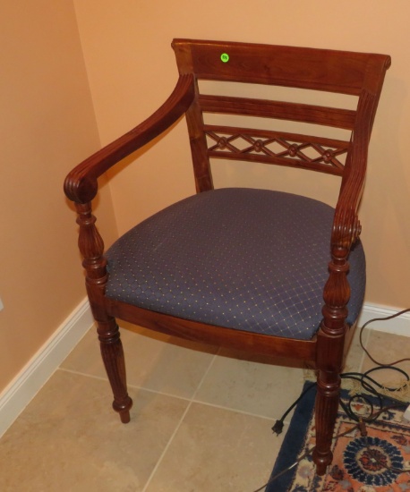 pair of carved wood armchairs with reeded arms and legs, upholstered seats. 32” H x 22” W x 19” D.