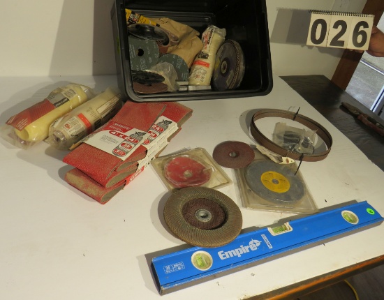mixed sanding belts, sanding disks, level and paint rollers (Note: plastic container shown in photo
