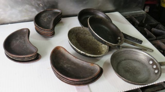 mixed lot of commercial fry pans and cast iron side plates