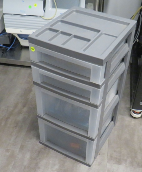 4 drawer plastic storage cabinet with mixed supplies