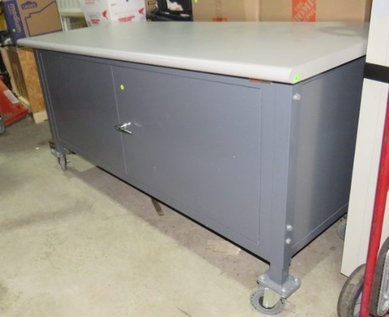 Industrial steel cabinet with Formica top on castors 72" x 30"  adjustable height