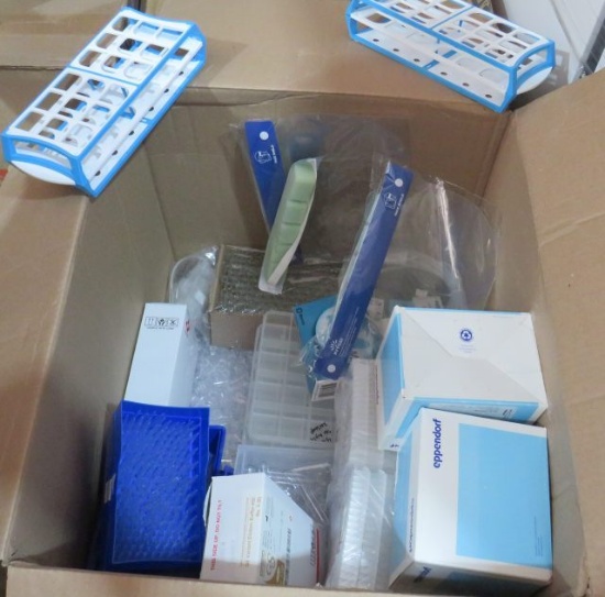 box of mixed lab supplies including pipettes, test tubes, blood collection needles, Dura film