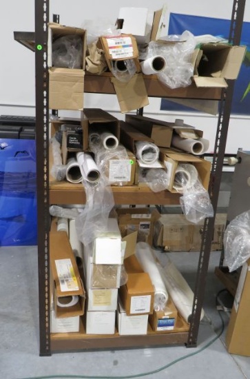 assorted partial and full rolls different widths canvas and printing paper