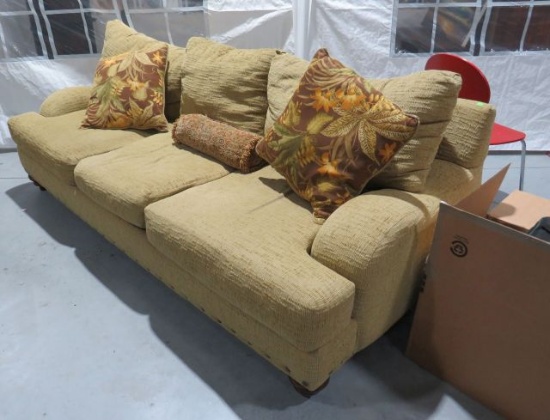 brown mustard colored 3 cushion sofa