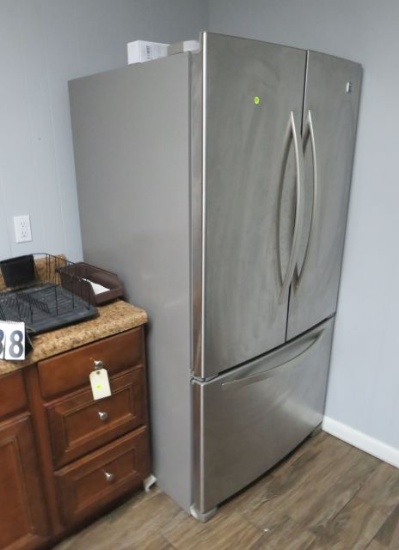 Kenmore stainless steel refrigerator side by side under freezer