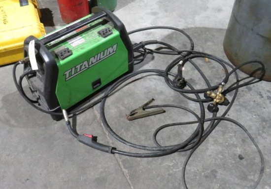 Titanium wire feed suitcase welder with gas hose and gauge