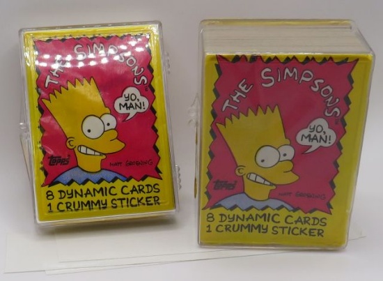 Two plastic cases with approximately 100 Simpson Cards including 3 packs of 8 with 1 lousy sticker