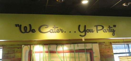 interior raised letter sign "We Cater You Party"