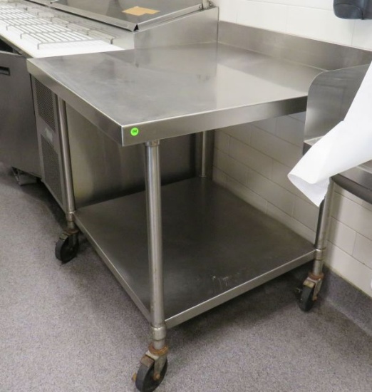 stainless steel table with 4" back splash 36" x 36" x 36" high on casters